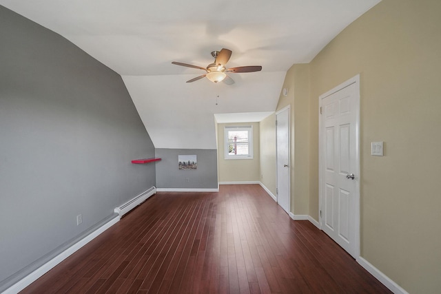 bonus room featuring baseboards, a ceiling fan, wood finished floors, vaulted ceiling, and a baseboard heating unit