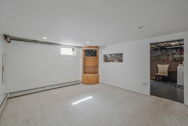 basement with washer / clothes dryer and baseboard heating