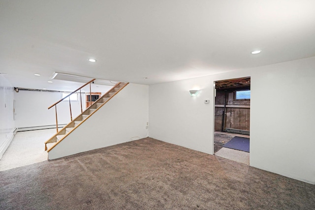 finished basement with carpet floors, a baseboard radiator, stairs, and recessed lighting