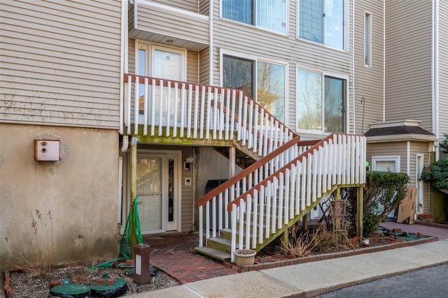 view of property featuring stairs