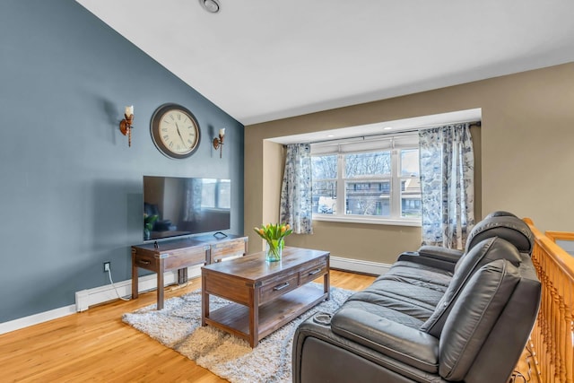 living area featuring vaulted ceiling, a baseboard radiator, wood finished floors, and baseboards