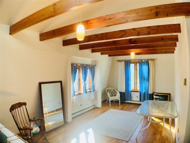 interior space with beam ceiling, baseboard heating, and wood finished floors