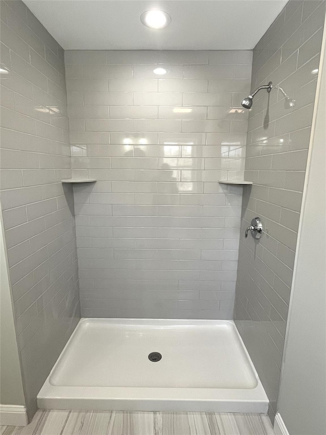 full bath featuring a shower stall