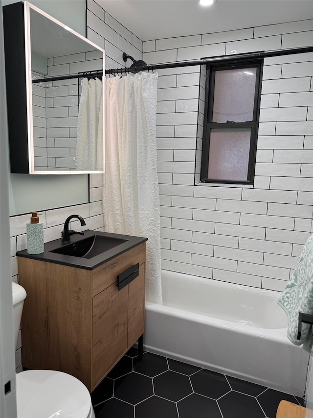 full bathroom with vanity, shower / tub combo, tile patterned flooring, and toilet