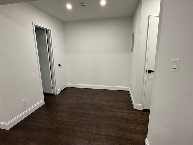 hall with baseboards, dark wood finished floors, and recessed lighting