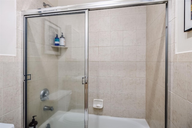 full bathroom with combined bath / shower with glass door