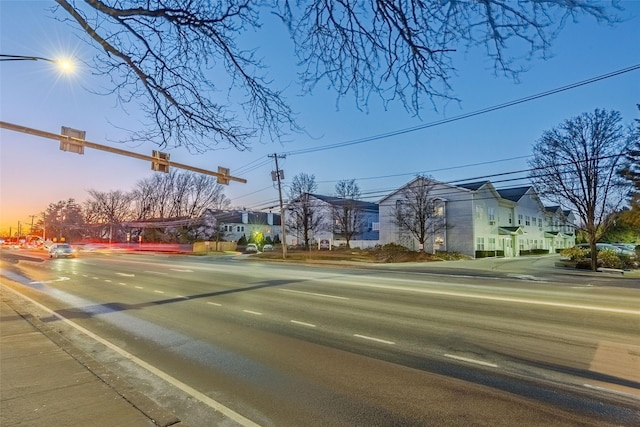 view of street with sidewalks and a residential view