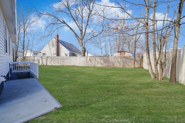 view of yard with a patio area and a fenced backyard