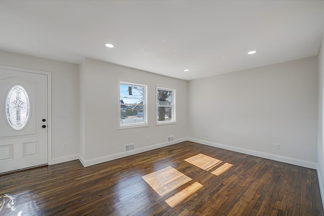 entryway featuring plenty of natural light, wood-type flooring, and visible vents