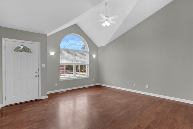 entryway featuring ceiling fan, high vaulted ceiling, wood finished floors, and baseboards