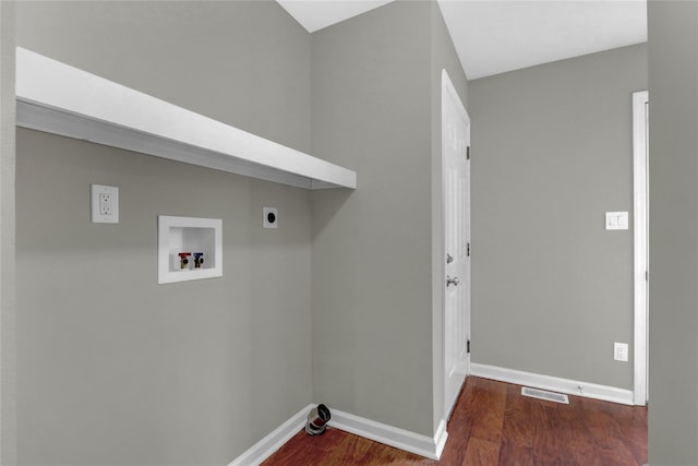 laundry area featuring hookup for a washing machine, visible vents, wood finished floors, laundry area, and baseboards