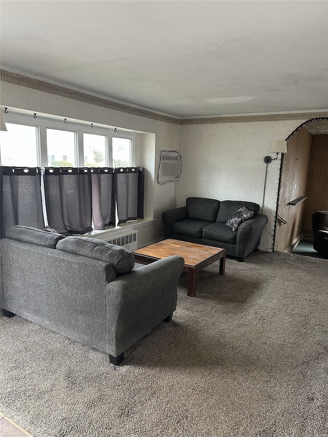 carpeted living area featuring ornamental molding, a wealth of natural light, and wallpapered walls