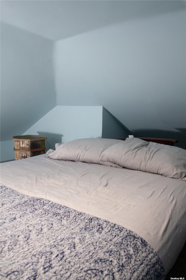 74 Wisconsin St, Long Beach, NY 11561 - bedroom featuring lofted ceiling
