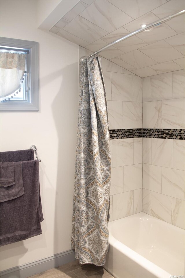 74 Wisconsin St, Long Beach, NY 11561 - bathroom with shower / tub combo with curtain