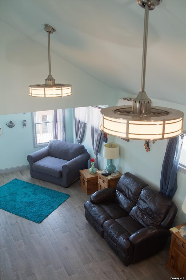 74 Wisconsin St, Long Beach, NY 11561 - living room featuring high vaulted ceiling and wood finished floors