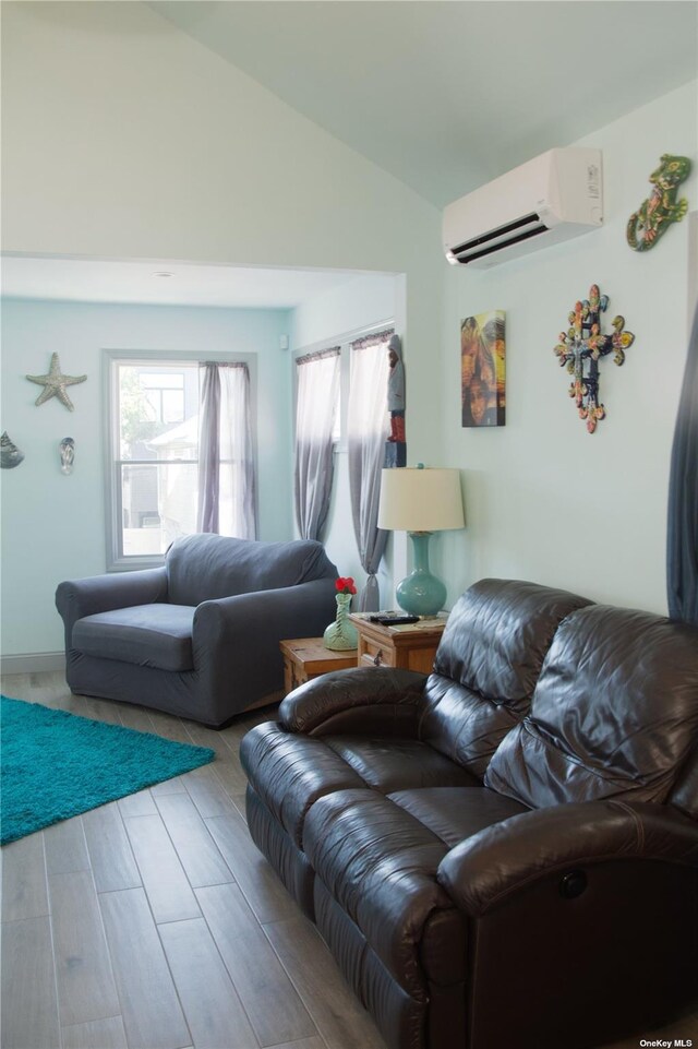 74 Wisconsin St, Long Beach, NY 11561 - living room featuring lofted ceiling, a wall unit AC, and wood finished floors