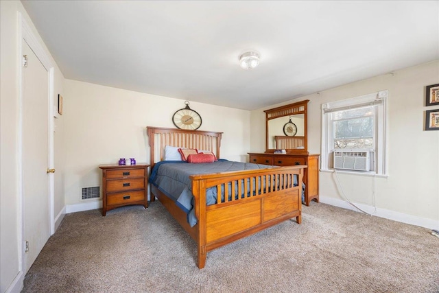 carpeted bedroom featuring cooling unit, visible vents, and baseboards