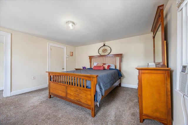 carpeted bedroom featuring baseboards