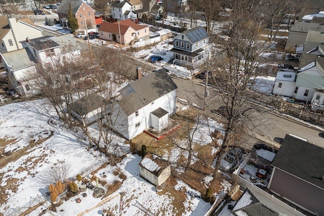 snowy aerial view featuring a residential view