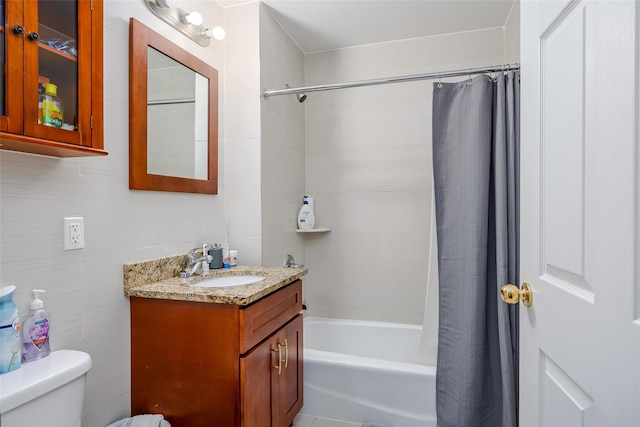 bathroom featuring vanity, toilet, and shower / tub combo