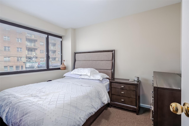 carpeted bedroom with baseboards