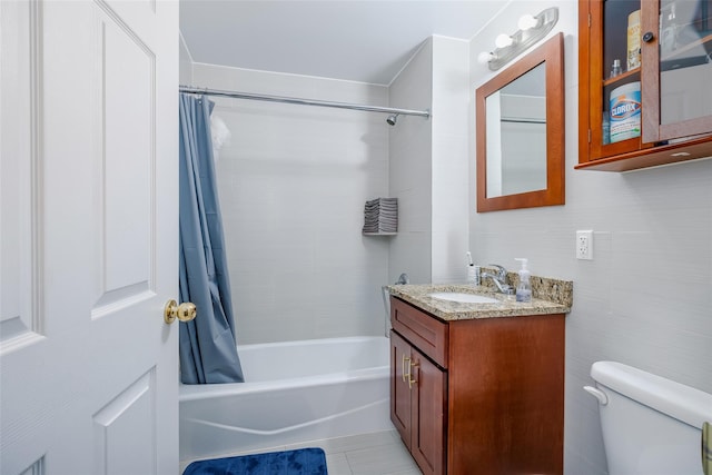 bathroom featuring vanity, toilet, and shower / bath combo with shower curtain