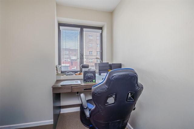 office with carpet flooring and baseboards