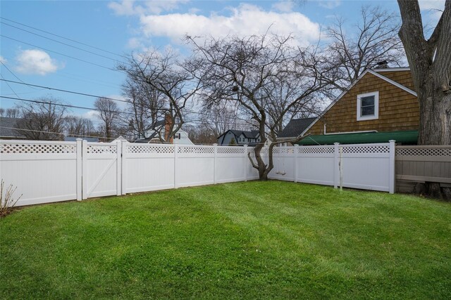 view of yard with a fenced backyard