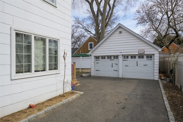 detached garage with fence