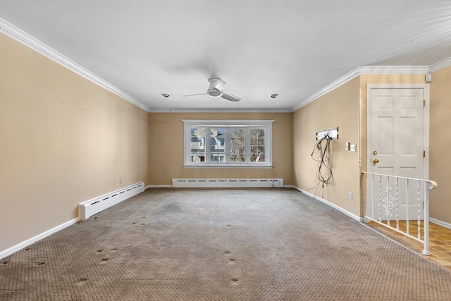 carpeted spare room with a baseboard heating unit, ornamental molding, baseboards, and ceiling fan