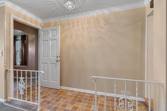 interior space featuring baseboards and ornamental molding