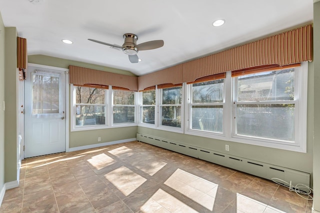 unfurnished sunroom with a baseboard radiator, vaulted ceiling, and ceiling fan