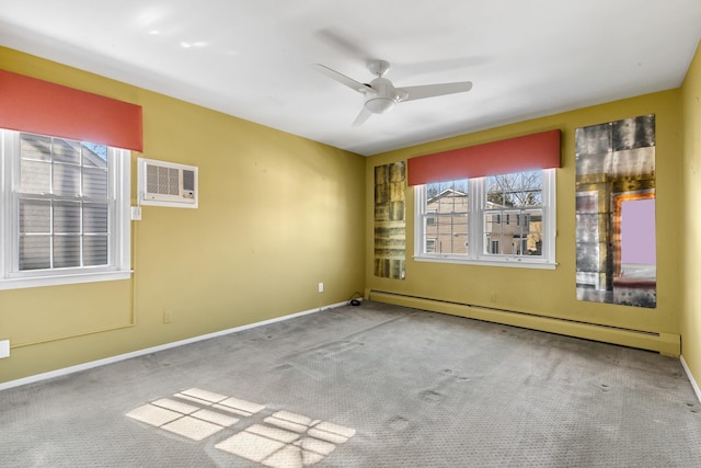 carpeted empty room featuring a ceiling fan, baseboards, a wall unit AC, and baseboard heating