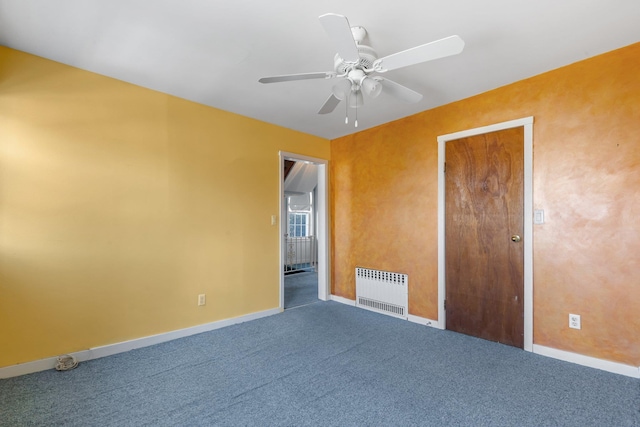 unfurnished bedroom featuring ceiling fan, radiator heating unit, carpet flooring, and baseboards