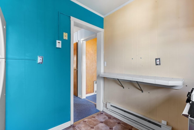 corridor featuring baseboard heating and crown molding