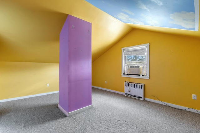 bonus room with carpet floors, radiator heating unit, vaulted ceiling, cooling unit, and baseboards