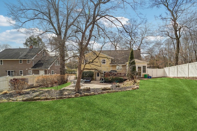 view of yard featuring a patio area and a fenced backyard