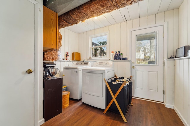 laundry room featuring wood ceiling, wood finished floors, and separate washer and dryer