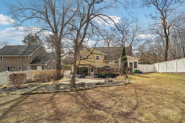 view of yard with a patio area and a fenced backyard