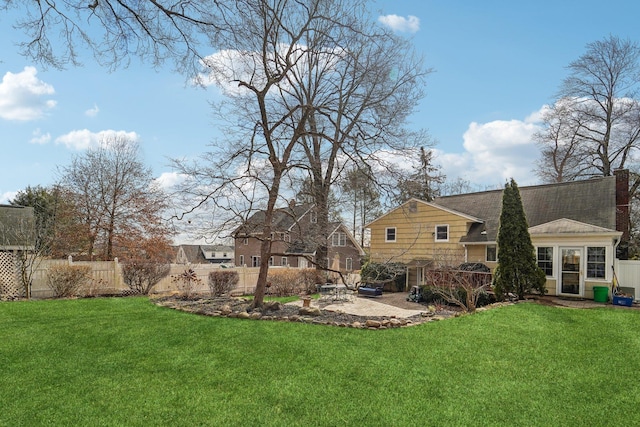 view of yard with a patio and fence