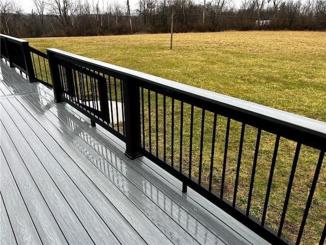 wooden terrace with a yard