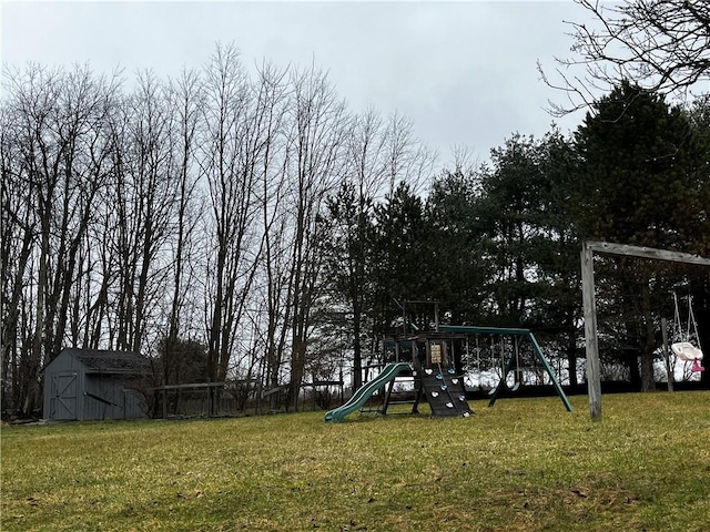 community playground with a shed, a lawn, and an outdoor structure