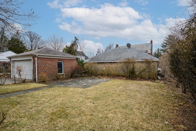 view of yard with an outbuilding and a patio area