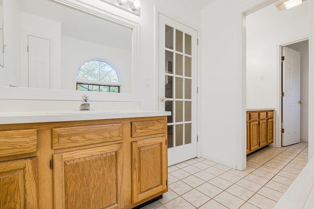 bathroom featuring tile patterned flooring and vanity