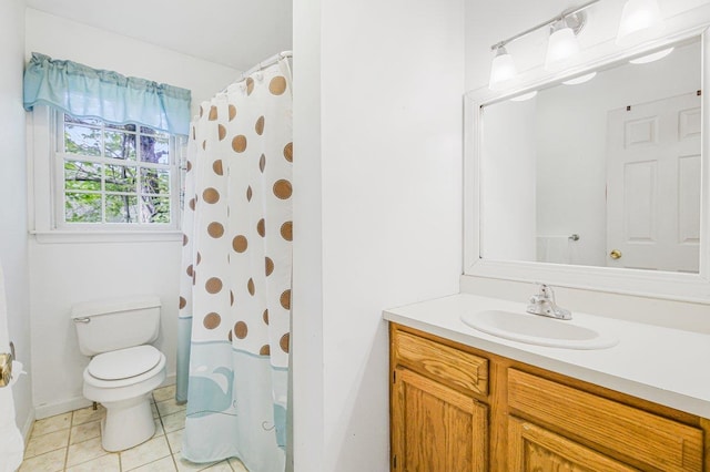 bathroom featuring tile patterned flooring, a shower with curtain, vanity, and toilet