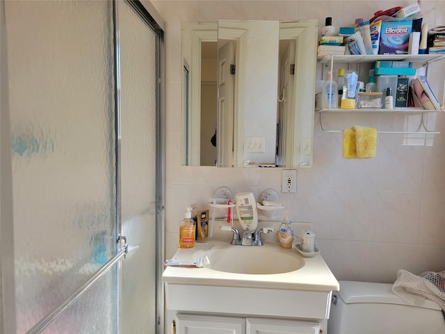 bathroom featuring a shower stall, backsplash, tile walls, and vanity