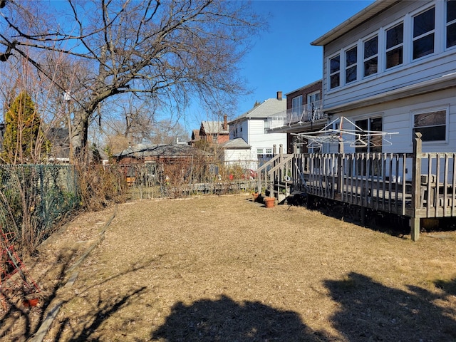 view of yard with a deck and a fenced backyard