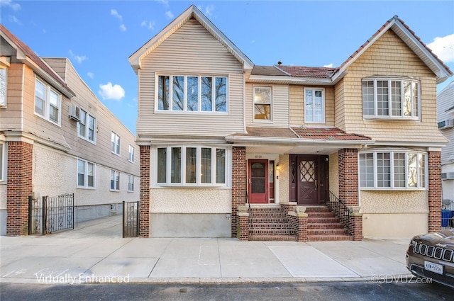 multi unit property with brick siding and fence