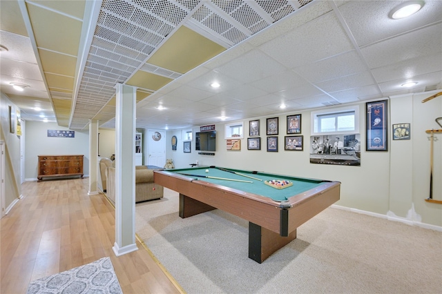 game room with light wood-type flooring, billiards, a paneled ceiling, and baseboards