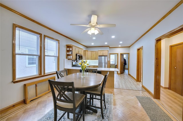 dining space featuring crown molding, recessed lighting, a ceiling fan, and baseboards